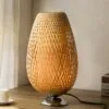 Lampa nocna owalna z rattanu z metalową podstawą