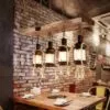 Lampa wisząca z drewna dryfowego w stylu industrialnym z lampionami LED