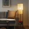 Nowoczesna lampa biurkowa z rattanu i metalu w cylindrycznym kształcie na nóżkach Nowoczesna lampa biurkowa z rattanu i metalu w cylindrycznym kształcie na nóżkach