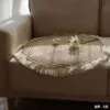 Okrągły dywan z bawełny i lnu z pomponami